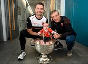 29 July 2024; 4-month-old Faé McKee, from Portadown, with Armagh captain Aidan Forker, and manager Kieran McGeeney, and the Sam Maguire cup during the All-Ireland Football Champions visit to the Craigavon Area Hospital in Portadown, Armagh. Photo by Ramsey Cardy/Sportsfile