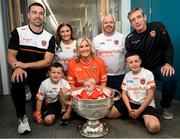 29 July 2024; Armagh captain Aidan Forker, and manager Kieran McGeeney, with the McKee family, including 4 month old Faé in the Sam Maguire cup during the All-Ireland Football Champions visit to the Craigavon Area Hospital in Portadown, Armagh. Photo by Ramsey Cardy/Sportsfile
