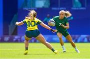 29 July 2024; Beibhinn Parsons of Team Ireland in action against Isabella Nasser of Team Australia during the Women's Rugby Sevens Pool B match between Team Ireland and Team Australia at the Stade de France during the 2024 Paris Summer Olympic Games in Paris, France. Photo by Hugo Pfeiffer/Sportsfile