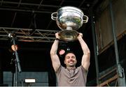 29 July 2024; Armagh captain Aidan Forker holds the Sam Maguire Cup aloft at the homecoming celebrations of the All-Ireland Senior Football Champions at BOX-IT Athletic Grounds in Armagh. Photo by Ramsey Cardy/Sportsfile