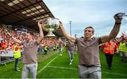 29 July 2024; Armagh captain Aidan Forker, left, and Armagh manager Kieran McGeeney hold the Sam Maguire Cup aloft at the homecoming celebrations of the All-Ireland Senior Football Champions at BOX-IT Athletic Grounds in Armagh. Photo by Ramsey Cardy/Sportsfile