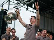 29 July 2024; Ethan Rafferty lifts the Sam Maguire Cup at the homecoming celebrations of the All-Ireland Senior Football Champions at BOX-IT Athletic Grounds in Armagh. Photo by Ramsey Cardy/Sportsfile