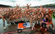 29 July 2024; Armagh players and backroom staff celebrate on stage with the Sam Maguire Cup at the homecoming celebrations of the All-Ireland Senior Football Champions at BOX-IT Athletic Grounds in Armagh. Photo by Ramsey Cardy/Sportsfile