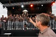 29 July 2024; Armagh manager Kieran McGeeney takes a picture of his players celebrating at the homecoming celebrations of the All-Ireland Senior Football Champions at BOX-IT Athletic Grounds in Armagh. Photo by Ramsey Cardy/Sportsfile