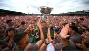 29 July 2024; Rian O'Neill holds the Sam Maguire Cup aloft at the homecoming celebrations of the All-Ireland Senior Football Champions at BOX-IT Athletic Grounds in Armagh. Photo by Ramsey Cardy/Sportsfile