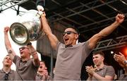 29 July 2024; Jemar Hall, right, and Blaine Hughes lift the Sam Maguire Cup at the homecoming celebrations of the All-Ireland Senior Football Champions at BOX-IT Athletic Grounds in Armagh. Photo by Ramsey Cardy/Sportsfile