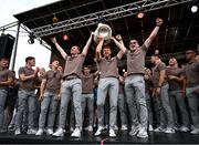 29 July 2024; Ross McQuillan, Jason Duffy and Aidan Nugent hold the Sam Maguire Cup aloft at the homecoming celebrations of the All-Ireland Senior Football Champions at BOX-IT Athletic Grounds in Armagh. Photo by Ramsey Cardy/Sportsfile