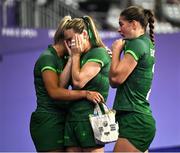 29 July 2024; Béibhinn Parsons of Team Ireland, centre, is consoled by teammate Erin King, left, after the Women's Rugby Sevens quarter-final match between Team Ireland and Team Australia at the Stade de France during the 2024 Paris Summer Olympic Games in Paris, France. Photo by David Fitzgerald/Sportsfile