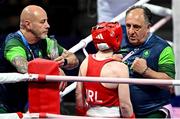 30 July 2024; Team Ireland head coach Zaur Antia, right, and Team Ireland coach Damian Kennedy, left, speak with Jennifer Lehane of Team Ireland during her women's -54kg round of 16 bout against Yuan Chang of Team China at the North Paris Arena during the 2024 Paris Summer Olympic Games in Paris, France. Photo by David Fitzgerald/Sportsfile
