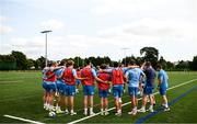 31 July 2024; Players huddle following a Leinster rugby training session at UCD in Dublin. Photo by Ramsey Cardy/Sportsfile