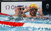 30 July 2024; Maxime Grousset of Team France and Kyle Chalmers of Team Australia after the men's 100m freestyle semi-finals at the Paris La Défense Arena during the 2024 Paris Summer Olympic Games in Paris, France. Photo by David Fitzgerald/Sportsfile