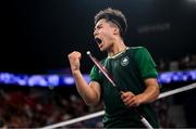 31 July 2024; Nhat Nguyen of Team Ireland celebrates a point during his men's singles group P match against Victor Axelsen of Team Denmark at the Porte de la Chapelle Arena during the 2024 Paris Summer Olympic Games in Paris, France. Photo by Stephen McCarthy/Sportsfile