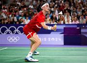 31 July 2024; Victor Axelsen of Team Denmark in action against Nhat Nguyen of Team Ireland during the men's singles group P match at the Porte de la Chapelle Arena during the 2024 Paris Summer Olympic Games in Paris, France. Photo by Stephen McCarthy/Sportsfile