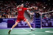 31 July 2024; Victor Axelsen of Team Denmark in action against Nhat Nguyen of Team Ireland during the men's singles group P match at the Porte de la Chapelle Arena during the 2024 Paris Summer Olympic Games in Paris, France. Photo by Stephen McCarthy/Sportsfile