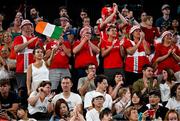 31 July 2024; Tham Nguyen, sister of Nhat Nguyen of Team Ireland, alongside Team Denmark supporters during his men's singles group P match against Victor Axelsen of Team Denmark at the Porte de la Chapelle Arena during the 2024 Paris Summer Olympic Games in Paris, France. Photo by Stephen McCarthy/Sportsfile