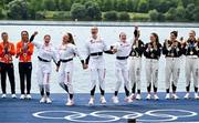31 July 2024; The Team Great Britain team, from left, Georgina Brayshaw, Lola Anderson, Hannah Scott and Lauren Henry, celebrate winning a gold medal in the women's quadruple sculls final at Vaires-sur-Marne Nautical Stadium during the 2024 Paris Summer Olympic Games in Paris, France. Photo by Brendan Moran/Sportsfile