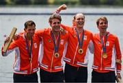 31 July 2024; The Team Netherlands team, from left, Koen Metsemakers, Tone Wieten, Finn Florijn and Lennart van Lierop celebrate winning a gold medal in the men's quadruple sculls final at Vaires-sur-Marne Nautical Stadium during the 2024 Paris Summer Olympic Games in Paris, France. Photo by Brendan Moran/Sportsfile