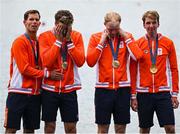 31 July 2024; The Team Netherlands team, from left, Koen Metsemakers, Tone Wieten, Finn Florijn and Lennart van Lierop celebrate winning a gold medal in the men's quadruple sculls final at Vaires-sur-Marne Nautical Stadium during the 2024 Paris Summer Olympic Games in Paris, France. Photo by Brendan Moran/Sportsfile