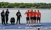 31 July 2024; The Team Netherlands team, from left, Koen Metsemakers, Tone Wieten, Finn Florijn and Lennart van Lierop celebrate winning a gold medal in the men's quadruple sculls final as Team Italy look on at Vaires-sur-Marne Nautical Stadium during the 2024 Paris Summer Olympic Games in Paris, France. Photo by Brendan Moran/Sportsfile