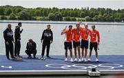 31 July 2024; The Team Netherlands team, from left, Koen Metsemakers, Tone Wieten, Finn Florijn and Lennart van Lierop celebrate winning a gold medal in the men's quadruple sculls final as Team Italy look on at Vaires-sur-Marne Nautical Stadium during the 2024 Paris Summer Olympic Games in Paris, France. Photo by Brendan Moran/Sportsfile