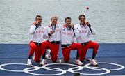 31 July 2024; The Team  Poland team, from left, Mateusz Biskup, Miroslaw Zietarski, Dominik Czaja, and Fabian Baranski with their bronze medals after finishing third in the men's quadruple sculls final as Team Italy look on at Vaires-sur-Marne Nautical Stadium during the 2024 Paris Summer Olympic Games in Paris, France. Photo by Brendan Moran/Sportsfile