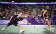 31 July 2024; Kim Astrup, left, and Anders Skaarup Rasmussen of Team Denmark in action against Takuro Hoki and Yugo Kobayashi of Team Japan during the men's singles group P match at the Porte de la Chapelle Arena during the 2024 Paris Summer Olympic Games in Paris, France. Photo by Stephen McCarthy/Sportsfile