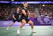 31 July 2024; Anders Skaarup Rasmussen, right, and Kim Astrup of Team Denmark in action against Takuro Hoki and Yugo Kobayashi of Team Japan during the men's singles group P match at the Porte de la Chapelle Arena during the 2024 Paris Summer Olympic Games in Paris, France. Photo by Stephen McCarthy/Sportsfile