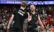 31 July 2024; Anders Skaarup Rasmussen, right, and Kim Astrup of Team Denmark celebrate winning against Takuro Hoki and Yugo Kobayashi of Team Japan in the men's singles group P match at the Porte de la Chapelle Arena during the 2024 Paris Summer Olympic Games in Paris, France. Photo by Stephen McCarthy/Sportsfile