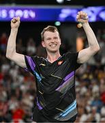 31 July 2024; Kim Astrup of Team Denmark celebrates winning with team mate Anders Skaarup Rasmussen, not pictured, against Takuro Hoki and Yugo Kobayashi of Team Japan in the men's singles group P match at the Porte de la Chapelle Arena during the 2024 Paris Summer Olympic Games in Paris, France. Photo by Stephen McCarthy/Sportsfile