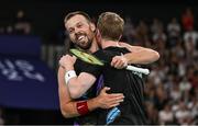31 July 2024; Anders Skaarup Rasmussen, left, and Kim Astrup of Team Denmark celebrate winning against Takuro Hoki and Yugo Kobayashi of Team Japan in the men's singles group P match at the Porte de la Chapelle Arena during the 2024 Paris Summer Olympic Games in Paris, France. Photo by Stephen McCarthy/Sportsfile