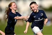31 July 2024; Ben Brady, right, and Anna Redmond during the Bank of Ireland Leinster Rugby Summer Camp at St Mary's College RFC in Dublin. Photo by Harry Murphy/Sportsfile