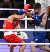 31 July 2024; Jude Gallagher of Team Ireland, right, in action against Carlo Paalam of Team Philippines during their men's 57kg preliminary round of 16 bout at the North Paris Arena during the 2024 Paris Summer Olympic Games in Paris, France. Photo by David Fitzgerald/Sportsfile