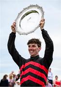 31 July 2024; Jockey Donagh Meyler celebrates with the trophy after winning the Tote Galway Plate on Pinkerton during day three of the Galway Races Summer Festival at Ballybrit Racecourse in Galway. Photo by Seb Daly/Sportsfile