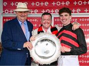 31 July 2024; Trainer Noel Meade, left, owner Philip Polly, centre, and jockey Donagh Meyler celebrate with the trophy after sending out Pinkerton to win the Tote Galway Plate during day three of the Galway Races Summer Festival at Ballybrit Racecourse in Galway. Photo by Seb Daly/Sportsfile