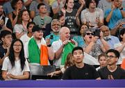31 July 2024; Team Ireland supporters watch Rachael Darragh of Team Ireland in action against Carolina Marin of Team Spain during the women's singles group L match at the Porte de la Chapelle Arena during the 2024 Paris Summer Olympic Games in Paris, France. Photo by Stephen McCarthy/Sportsfile