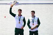 1 August 2024; Philip Doyle, left, and Daire Lynch of Team Ireland with their bronze medals in the awards ceremony after the men's double sculls A final at Vaires-sur-Marne Nautical Stadium during the 2024 Paris Summer Olympic Games in Paris, France. Photo by Stephen McCarthy/Sportsfile