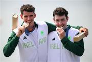 1 August 2024; Philip Doyle, left, and Daire Lynch of Team Ireland with their bronze medals in the awards ceremony after the men's double sculls A final at Vaires-sur-Marne Nautical Stadium during the 2024 Paris Summer Olympic Games in Paris, France. Photo by Stephen McCarthy/Sportsfile