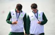 1 August 2024; Philip Doyle, left, and Daire Lynch of Team Ireland with their bronze medals in the awards ceremony after the men's double sculls A final at Vaires-sur-Marne Nautical Stadium during the 2024 Paris Summer Olympic Games in Paris, France. Photo by Stephen McCarthy/Sportsfile