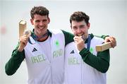1 August 2024; Philip Doyle, left, and Daire Lynch of Team Ireland with their bronze medals in the awards ceremony after the men's double sculls A final at Vaires-sur-Marne Nautical Stadium during the 2024 Paris Summer Olympic Games in Paris, France. Photo by Stephen McCarthy/Sportsfile