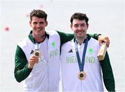 1 August 2024; Philip Doyle, left, and Daire Lynch of Team Ireland with their bronze medals in the awards ceremony after the men's double sculls A final at Vaires-sur-Marne Nautical Stadium during the 2024 Paris Summer Olympic Games in Paris, France. Photo by Stephen McCarthy/Sportsfile