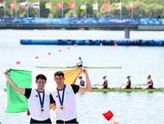 1 August 2024; Daire Lynch, left, and Philip Doyle of Team Ireland with their bronze medals after finishing third in the men's double sculls A final at Vaires-sur-Marne Nautical Stadium during the 2024 Paris Summer Olympic Games in Paris, France. Photo by Stephen McCarthy/Sportsfile