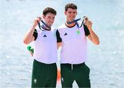 1 August 2024; Daire Lynch, left, and Philip Doyle of Team Ireland with their bronze medals after finishing third in the men's double sculls A final at Vaires-sur-Marne Nautical Stadium during the 2024 Paris Summer Olympic Games in Paris, France. Photo by Stephen McCarthy/Sportsfile