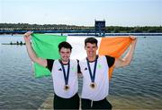 1 August 2024; Philip Doyle, right, and Daire Lynch of Team Ireland celebrate with their bronze medals after the men's double sculls A final at Vaires-sur-Marne Nautical Stadium during the 2024 Paris Summer Olympic Games in Paris, France. Photo by Stephen McCarthy/Sportsfile