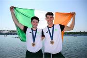 1 August 2024; Philip Doyle, right, and Daire Lynch of Team Ireland celebrate with their bronze medals after the men's double sculls A final at Vaires-sur-Marne Nautical Stadium during the 2024 Paris Summer Olympic Games in Paris, France. Photo by Stephen McCarthy/Sportsfile