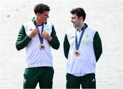 1 August 2024; Philip Doyle, left, and Daire Lynch of Team Ireland with their bronze medals after the men's double sculls A final at Vaires-sur-Marne Nautical Stadium during the 2024 Paris Summer Olympic Games in Paris, France. Photo by Stephen McCarthy/Sportsfile