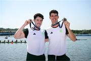 1 August 2024; Philip Doyle, right, and Daire Lynch of Team Ireland celebrate with their bronze medals after the men's double sculls A final at Vaires-sur-Marne Nautical Stadium during the 2024 Paris Summer Olympic Games in Paris, France. Photo by Stephen McCarthy/Sportsfile