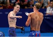 1 August 2024; Tom Fannon of Team Ireland celebrates with Mikel Schreuders of Team Aruba after finishing first in his men's 50m freestyle heat at the Paris La Défense Arena during the 2024 Paris Summer Olympic Games in Paris, France. Photo by Ian MacNicol/Sportsfile