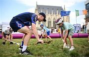 1 August 2024; Ferdinand D'Ardium, aged 7, practices his hurling skills with Naoise Greene of Paris Gaels at Fesport Festival at the Cháteau de Vincennes during the 2024 Paris Summer Olympic Games in Paris, France. Photo by Sam Barnes/Sportsfile