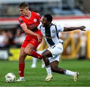 1 August 2024; Emmanuel Umeh of FC Zurich is tackled by Evan Caffrey of Shelbourne during the UEFA Conference League second qualifying round second leg match between Shelbourne and FC Zurich at Tolka Park in Dublin. Photo by Thomas Flinkow/Sportsfile