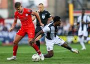 1 August 2024; Emmanuel Umeh of FC Zurich is fouled by Evan Caffrey of Shelbourne during the UEFA Conference League second qualifying round second leg match between Shelbourne and FC Zurich at Tolka Park in Dublin. Photo by Thomas Flinkow/Sportsfile